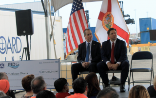 Pictured from left to right, Congressman Mario Díaz-Balart, Florida Governor Ron DeSantis, and United States Department of Transportation Secretary Elaine Chao